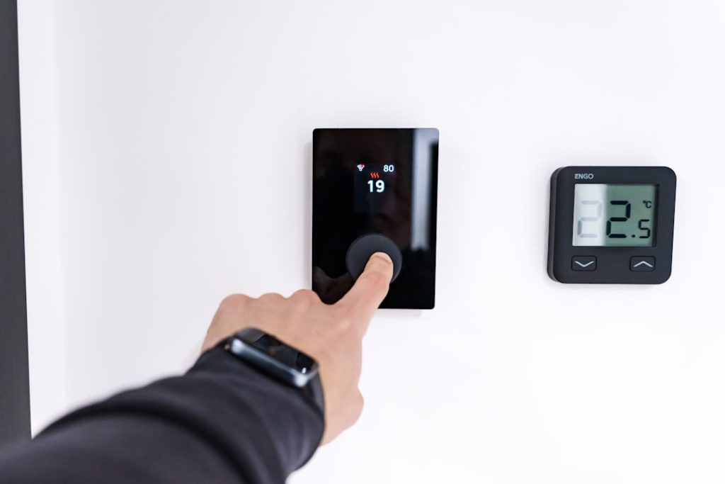 smart thermostat wire installed on wall modern home energy efficiency